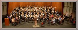 Tommy Johnson Tribute Concert with 99 Tubas, Jim Self conducting. (Click for larger image.)